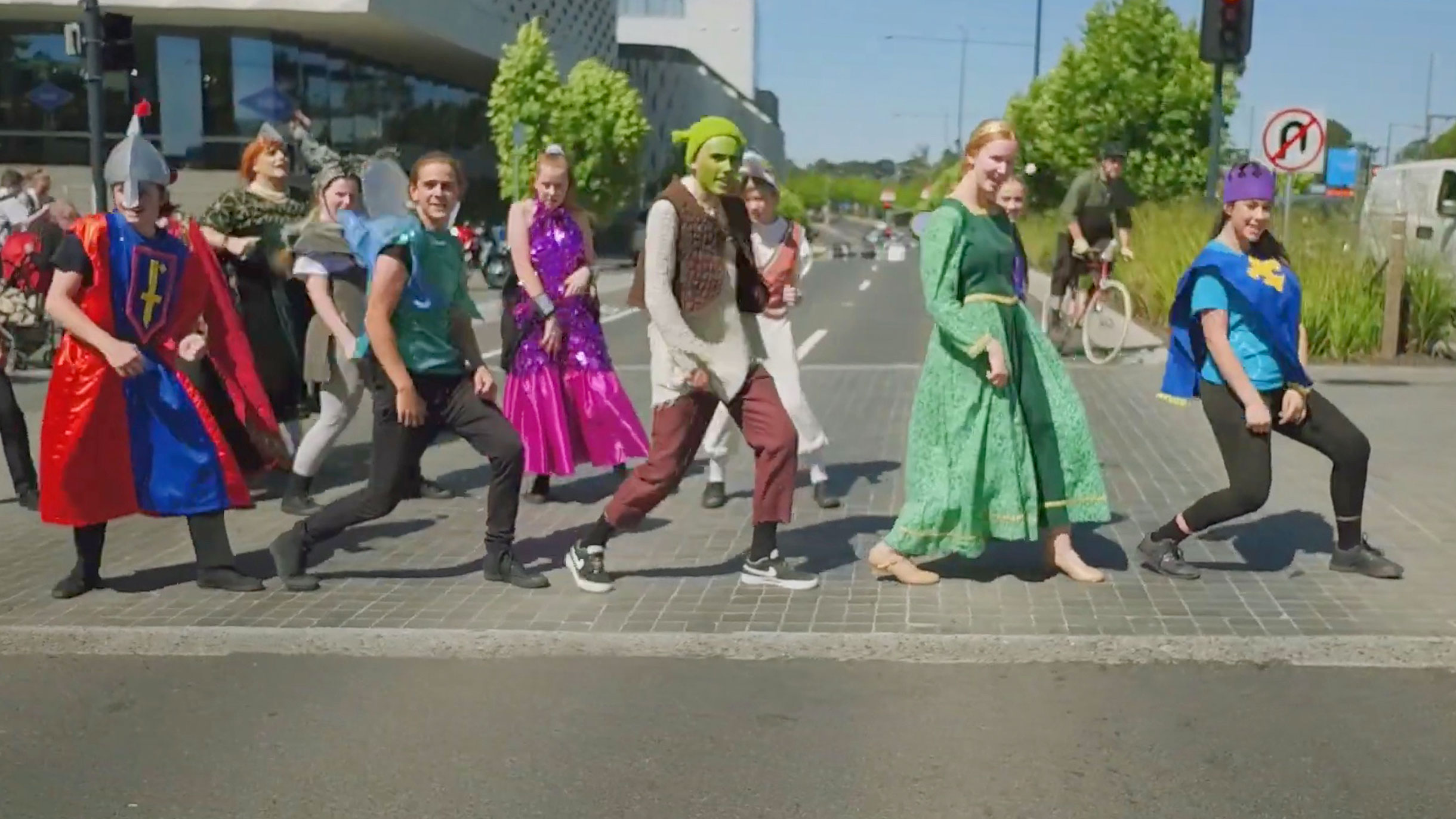 Students from Ringwood High School dressed as characters from Shrek the musical dancing in the street